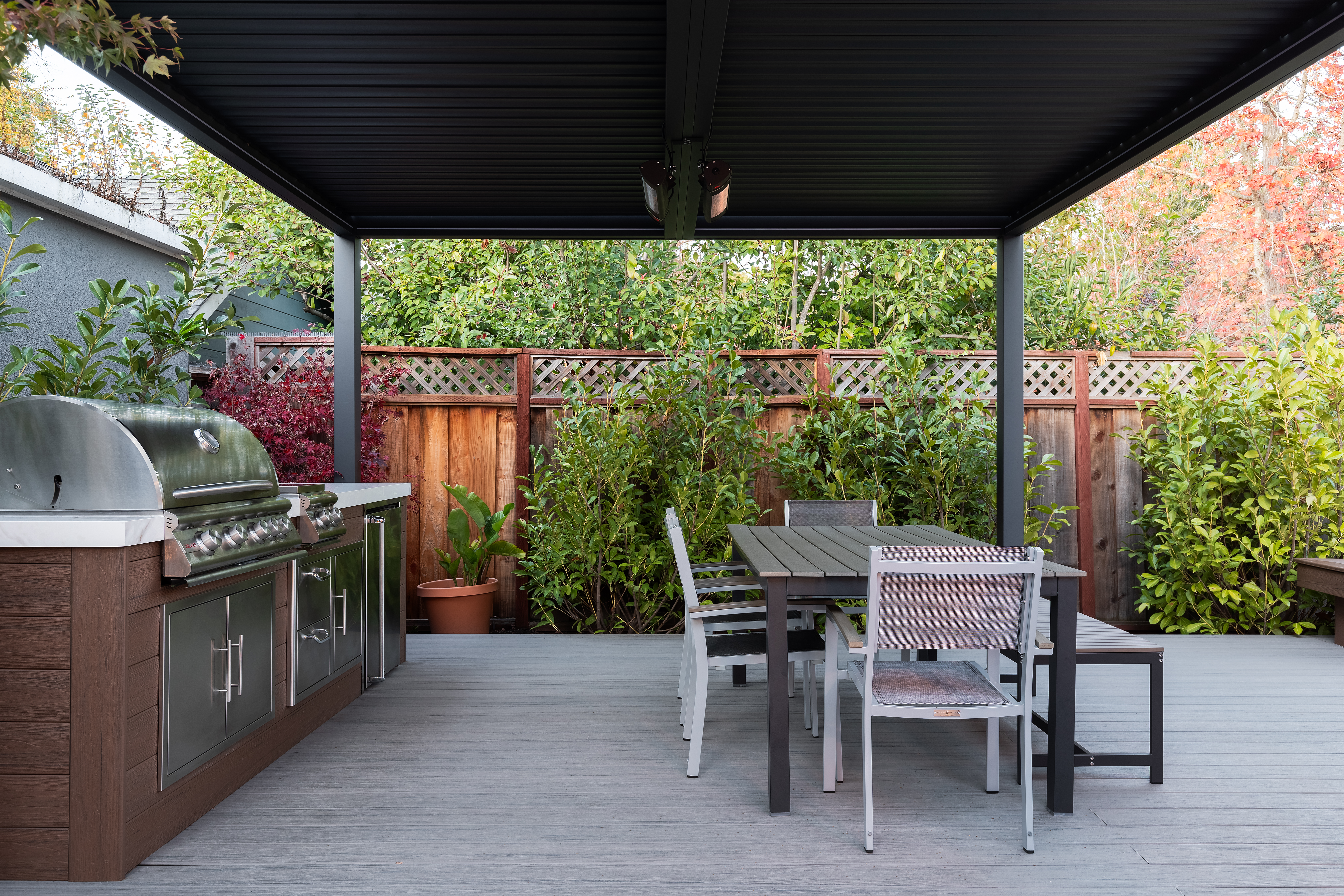 Privacy fence with lattice top in backyard setting